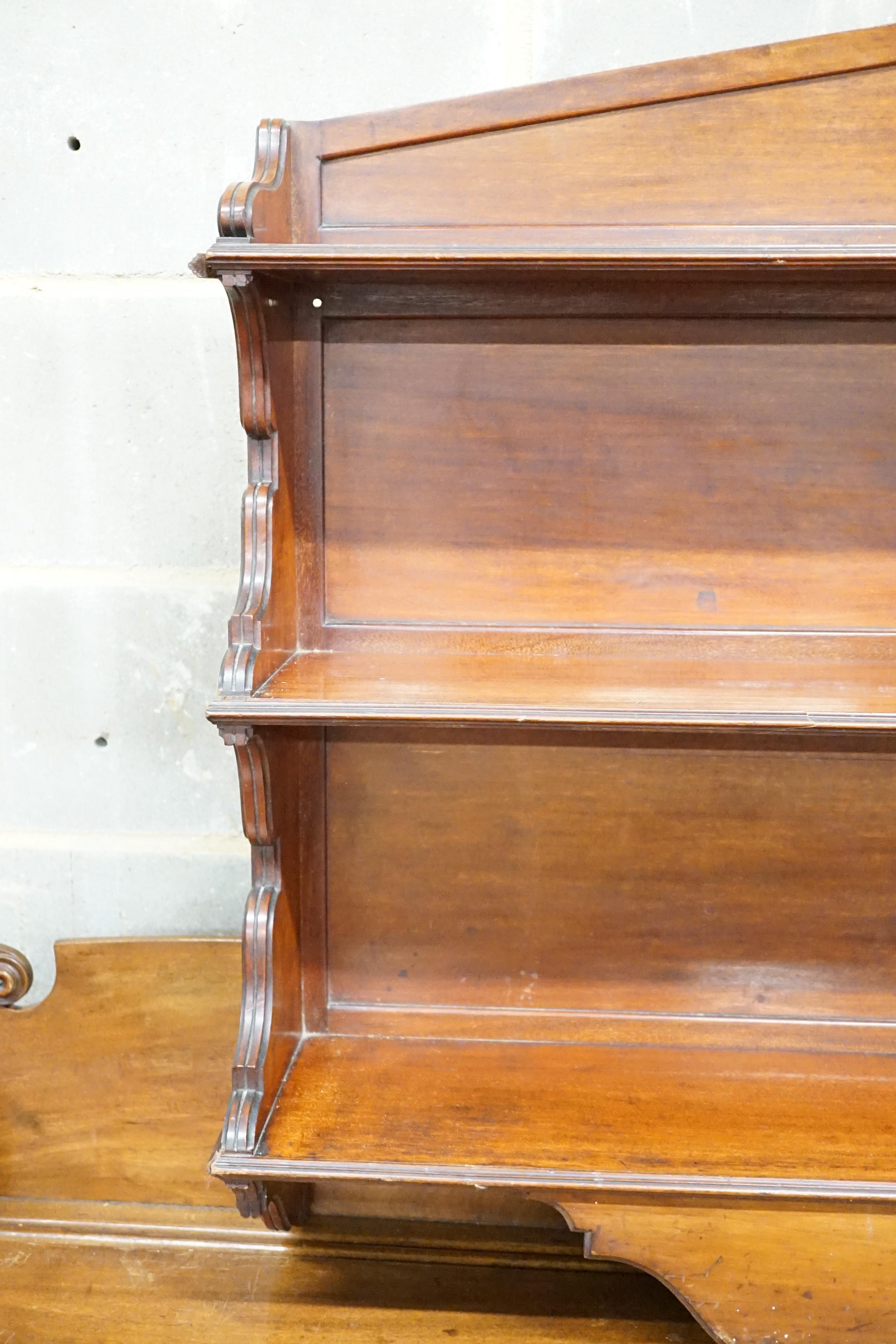 A late Victorian mahogany three tier wall shelf, width 86cm, height 86cm